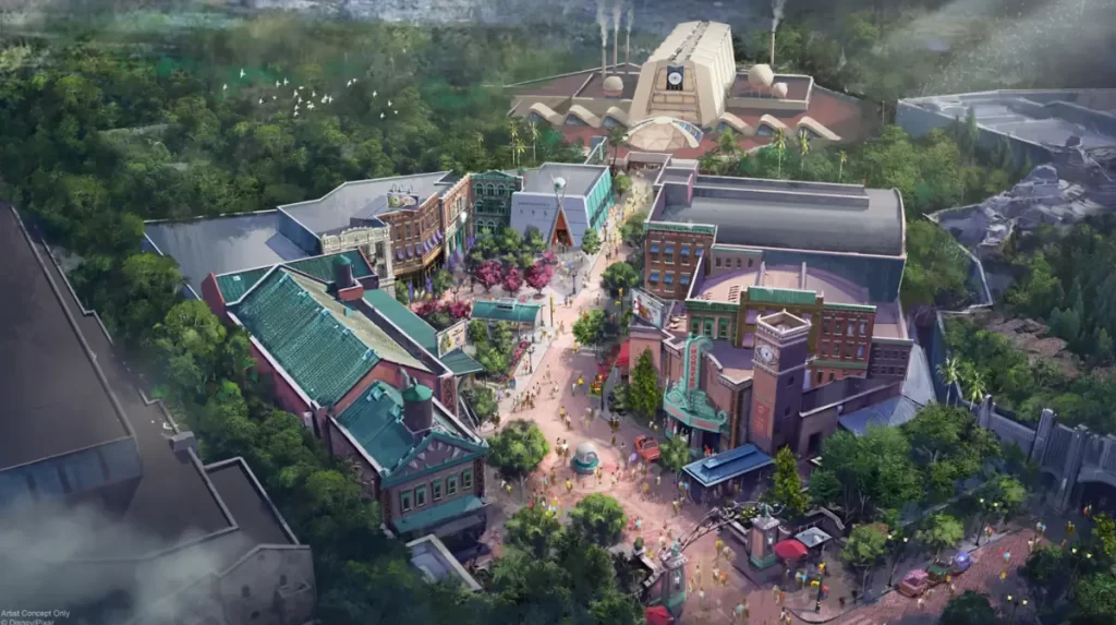 Ilustração conceitual da nova área temática de Monstros S.A. no Disney’s Hollywood Studios, mostrando a rua principal, prédios coloridos e a fábrica da Monsters, Inc. ao fundo.