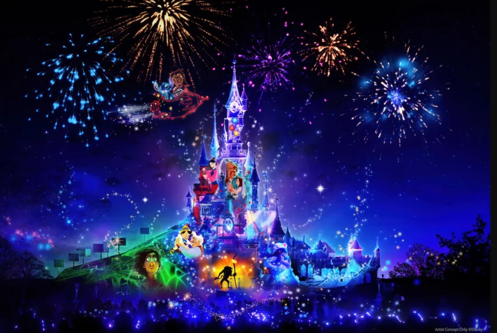 Show de fogos Disneyland Paris com projeções no castelo, fogos de artifício e personagens clássicos da Disney iluminando o céu.