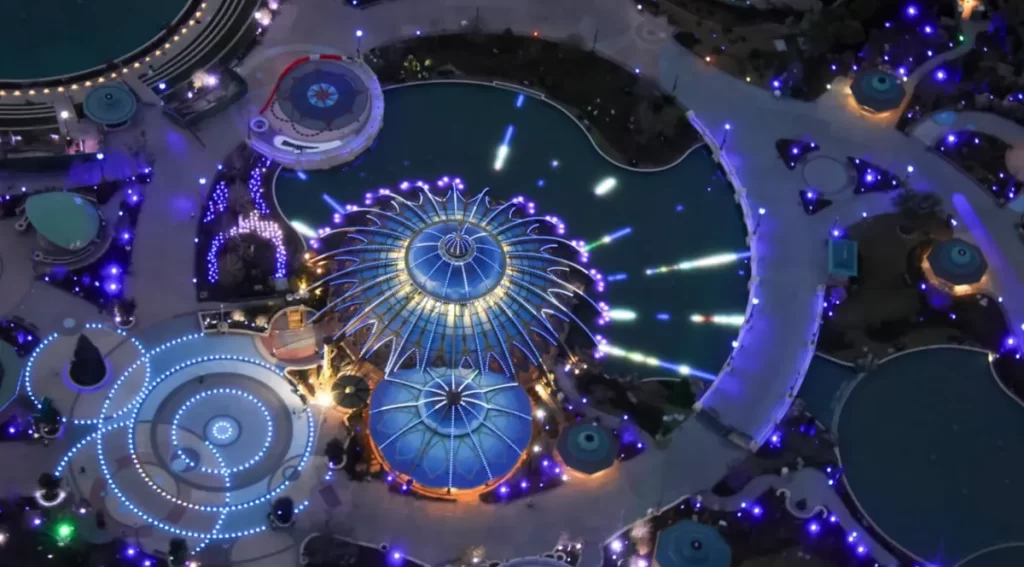 Vista aérea da Cosmos Fountain durante o espetáculo noturno no Celestial Park