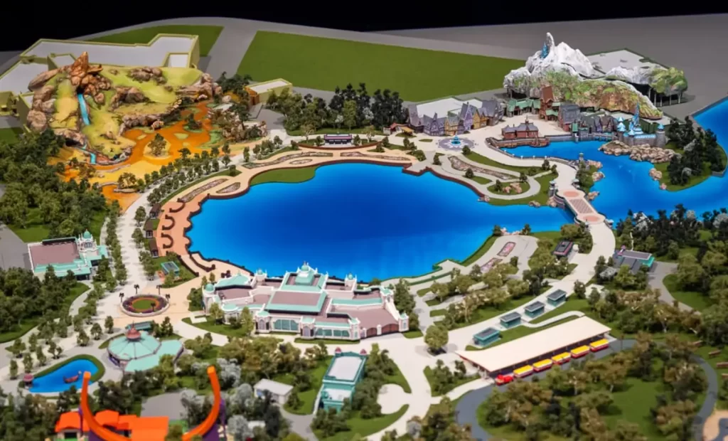 Maquete do masterplan da expansão da Disneyland Paris com áreas do Rei Leão e Frozen ao redor do lago central