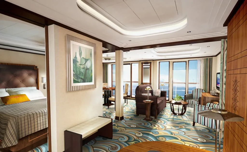 Cabine Concierge do Disney Fantasy com quarto amplo, sala integrada e varanda com vista para o oceano