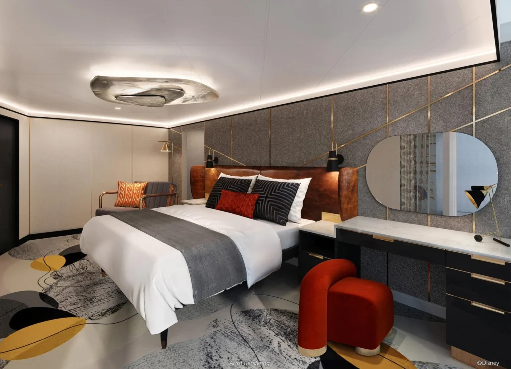 Suíte Os Incríveis no Disney Destiny com cama king, sofá e varanda com vista para o mar